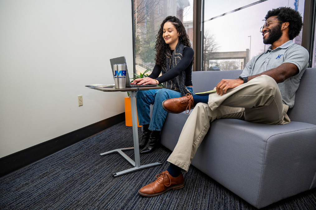 student employees sitting down and talking