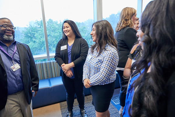 UMRFV employees talking at networking event