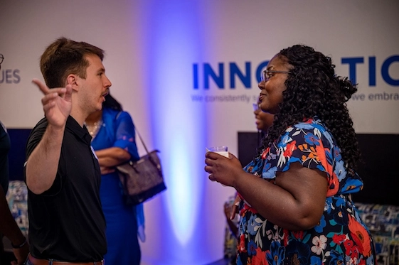 UMRF Ventures student employee talking to visitors