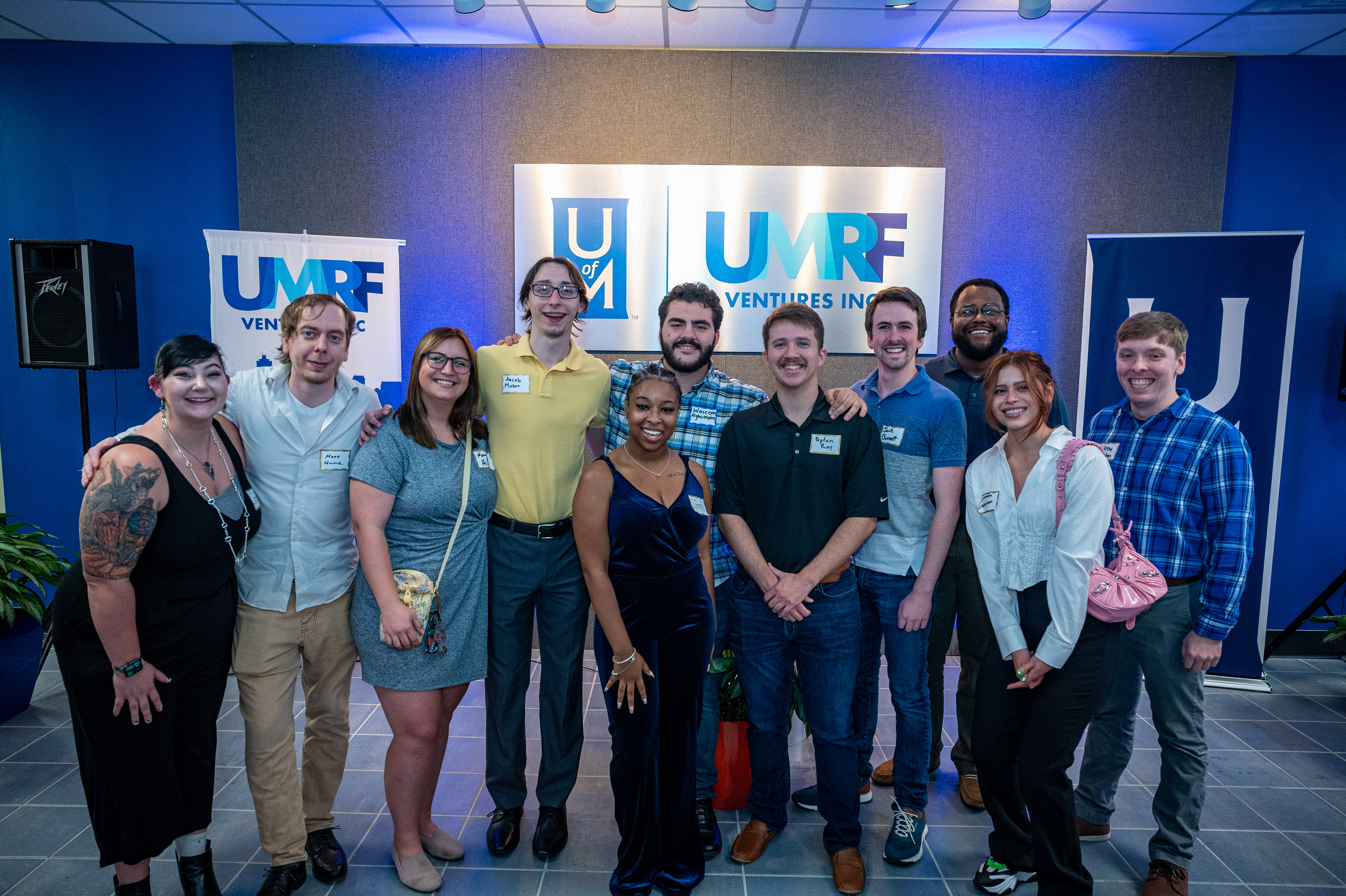 UMRF Ventures employees posing for a picture at a company event