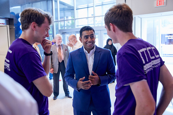 UMRF Ventures student employees talking with a business professional at a networking event